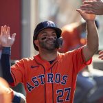 
              Houston Astros' Jose Altuve gets congratulations in the dugout after scoring on a single by Kyle Tucker against the Los Angeles Angels during the first inning of a baseball game in Anaheim, Calif., Thursday, July 14, 2022. (AP Photo/Alex Gallardo)
            