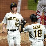 
              Pittsburgh Pirates' Jack Suwinski (65) is greeted by Ben Gamel after scoring on a sacrifice fly by Oneil Cruz off New York Yankees relief pitcher Lucas Luetge during the sixth inning of a baseball game in Pittsburgh, Tuesday, July 5, 2022. (AP Photo/Gene J. Puskar)
            
