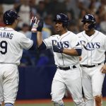 
              Tampa Bay Rays' Francisco Mejia, center, celebrates with the Ray's Yu Chang after scoring against the Boston Red Sox during the sixth inning of a baseball game Tuesday July 12, 2022, in St. Petersburg, Fla. (AP Photo/Scott Audette)
            