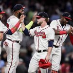 
              Atlanta Braves relief pitcher A.J. Minter, center, celebrates with teammates after a win over the Arizona Diamondbacks in a baseball game Saturday, July 30, 2022, in Atlanta. (AP Photo/Butch Dill)
            