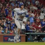 
              Los Angeles Dodgers' Freddie Freeman rounds the bases after hitting a solo home run during the ninth inning of a baseball game against the St. Louis Cardinals Tuesday, July 12, 2022, in St. Louis. (AP Photo/Jeff Roberson)
            