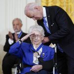 
              President Joe Biden awards the nation's highest civilian honor, the Presidential Medal of Freedom, to Wilma Vaught during a ceremony in the East Room of the White House in Washington, Thursday, July 7, 2022. Vaught, a retired brigadier general and one of the most decorated women in U.S. military history, broke gender barriers on her rise through the ranks of the Air Force. (AP Photo/Susan Walsh)
            