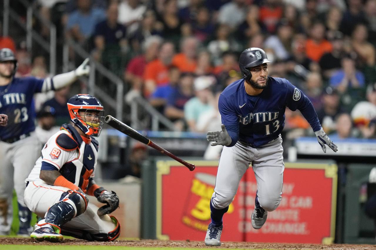 Seattle Mariners' Abraham Toro (13) watches his two-run single during the ninth inning of the team'...