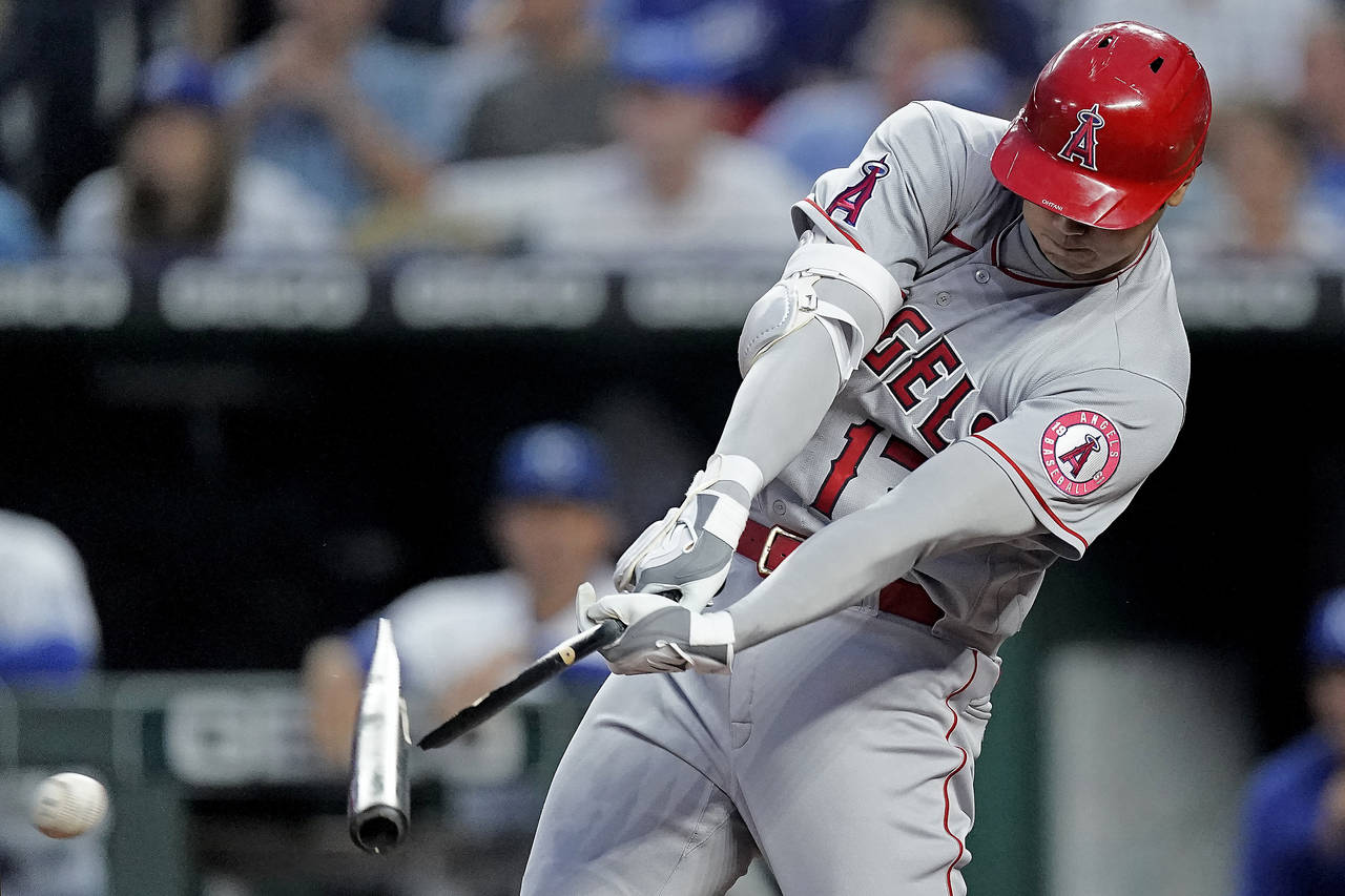 Los Angeles Angels' Shohei Ohtani breaks his bat as he hits a foul ball during the fifth inning of ...