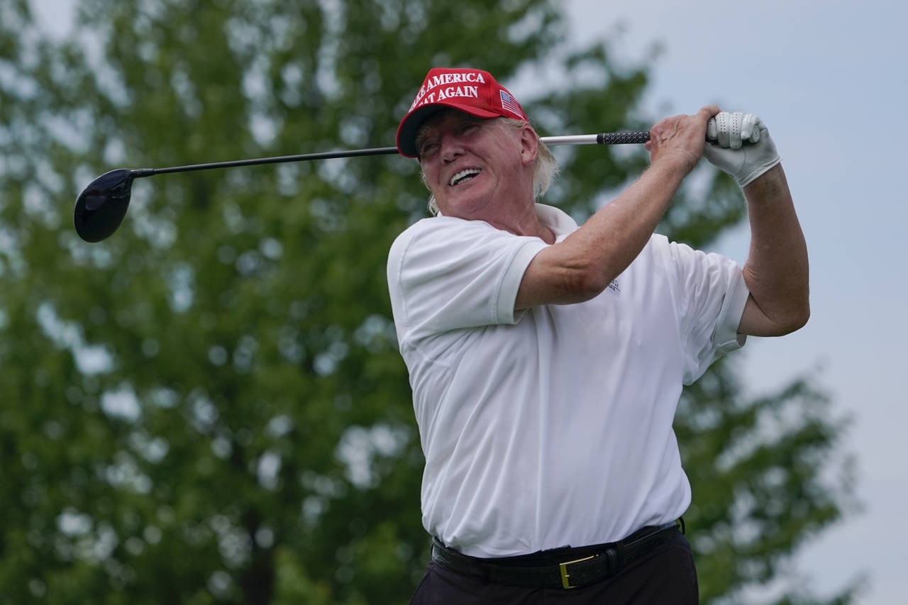 Former President Donald Trump plays during the pro-am round of the Bedminster Invitational LIV Golf...