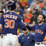
              Houston Astros' Jose Altuve, right, celebrates Kyle Tucker's (30) solo home run during the first inning of a baseball game against the Oakland Athletics, Sunday, July 17, 2022, in Houston. (AP Photo/Eric Christian Smith)
            