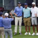 
              Former President Donald Trump, right, golfer Dustin Johnson, second from right, golfer Bryson DeChambeau, third from right, and Eric Trump pose for a picture as they play together during the pro-am round of the Bedminster Invitational LIV Golf tournament in Bedminster, N.J., Thursday, July 28, 2022. (AP Photo/Seth Wenig)
            