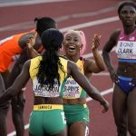 
              Gold medalist Shericka Jackson, of Jamaica,, silver medalist Shelly-Ann Fraser-Pryce, of Jamaica, celebrate after the final of the women's 200-meter run at the World Athletics Championships on Thursday, July 21, 2022, in Eugene, Ore. (AP Photo/Gregory Bull)
            