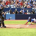 
              Toronto Blue Jays' starting pitcher Bo Bichette slides safely into home ahead of the throw to Tampa Bays Rays' catcher Rene Pinto during the first inning of a baseball game, Saturday, July 2, 2022 in Toronto. (Jon Blacker/The Canadian Press via AP)
            