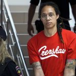 
              FILE - WNBA star and two-time Olympic gold medalist Brittney Griner is escorted to a courtroom for a hearing, in Khimki just outside Moscow, Russia, Thursday, July 7, 2022. The drug possession trial of WNBA star Griner has resumed, with the head of the Russian club she plays for in the offseason and a teammate from that squad testifying in support of her character and what she has meant for women’s basketball in the country. Griner, who pleaded guilty last week, did not testify as expected at the third day of the trial. (AP Photo/Alexander Zemlianichenko, File)
            