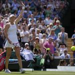 
              Kazakhstan's Elena Rybakina celebrates after beating Croatia's Petra Martic in a women's singles fourth round match on day eight of the Wimbledon tennis championships in London, Monday, July 4, 2022. (AP Photo/Alastair Grant)
            