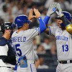 
              Kansas City Royals' Salvador Perez, right, celebrates with teammate Whit Merrifield after hitting a three-run home run against the New York Yankees during the fifth inning of a baseball game Friday, July 29, 2022, in New York. (AP Photo/Frank Franklin II)
            