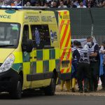 
              Alfa Romeo driver Guanyu Zhou of China is taken to ambulance during the British Formula One Grand Prix at the Silverstone circuit, in Silverstone, England, Sunday, July 3, 2022. (AP Photo/Matt Dunham, Pool)
            