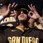 
              San Diego Padres' Manny Machado gestures in the dugout prior to a baseball game against the Los Angeles Dodgers Saturday, July 2, 2022, in Los Angeles. (AP Photo/Mark J. Terrill)
            