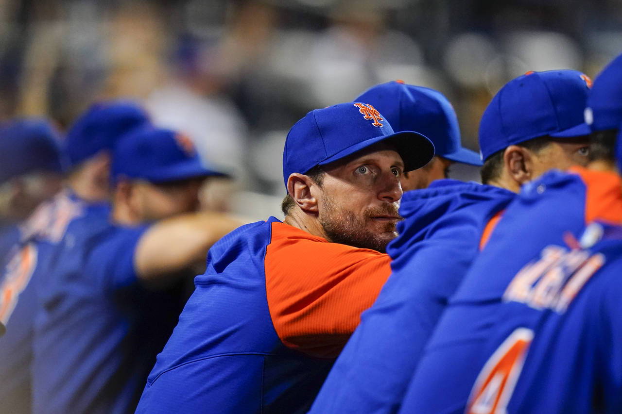 New York Mets pitcher Max Scherzer watches during the eighth inning of a baseball game against the ...