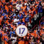 
              New York Mets fans cheer for New York Mets announcer and former player Keith Hernandez during a pre-game ceremony to retire his player number before a baseball game between the Mets and Miami Marlins, Saturday, July 9, 2022, in New York. (AP Photo/John Minchillo)
            