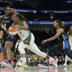 
              Seattle Storm guard Epiphanny Prince (11) drives against Dallas Wings center Teaira McCowan, left, during the first half of a WNBA basketball game, Tuesday, July 12, 2022 in Seattle. (AP Photo/Ted S. Warren)
            