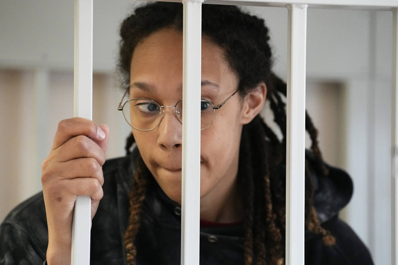 WNBA star and two-time Olympic gold medalist Brittney Griner stands in a cage at a court room prior...