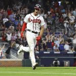 
              Atlanta Braves' Matt Olson and the fans react to his two-run home run against the New York Mets during the sixth inning of a baseball game Tuesday, July 12, 2022, in Atlanta. (Curtis Compton/Atlanta Journal-Constitution via AP)
            