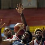 
              Langston Galloway of the U.S, fights for the ball with several Cuban players during the FIBA Americas qualifiers for the 2023 Basketball World Cup, In Havana, Cuba, Monday, July 4, 2022. The U.S. defeated Cuba 87-64. (AP Photo/Ramon Espinosa)
            