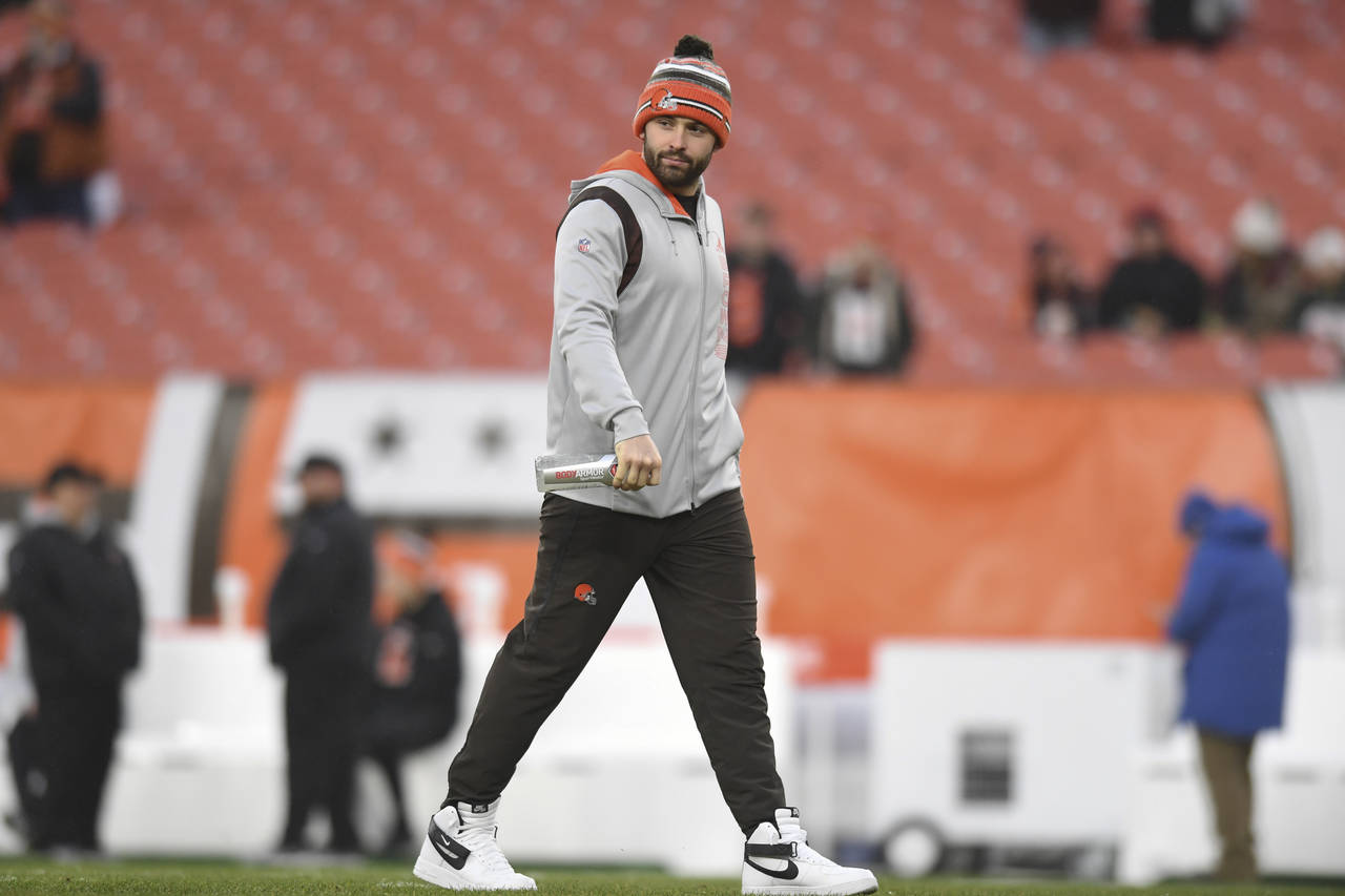 FILE - Cleveland Browns quarterback Baker Mayfield walks on the field before an NFL football game a...