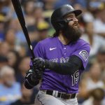 
              Colorado Rockies designated hitter Charlie Blackmon (19) watches his two-run home run against the Milwaukee Brewers during the third inning of a baseball game Friday, July 22, 2022, in Milwaukee. (AP Photo/Jeffrey Phelps)
            