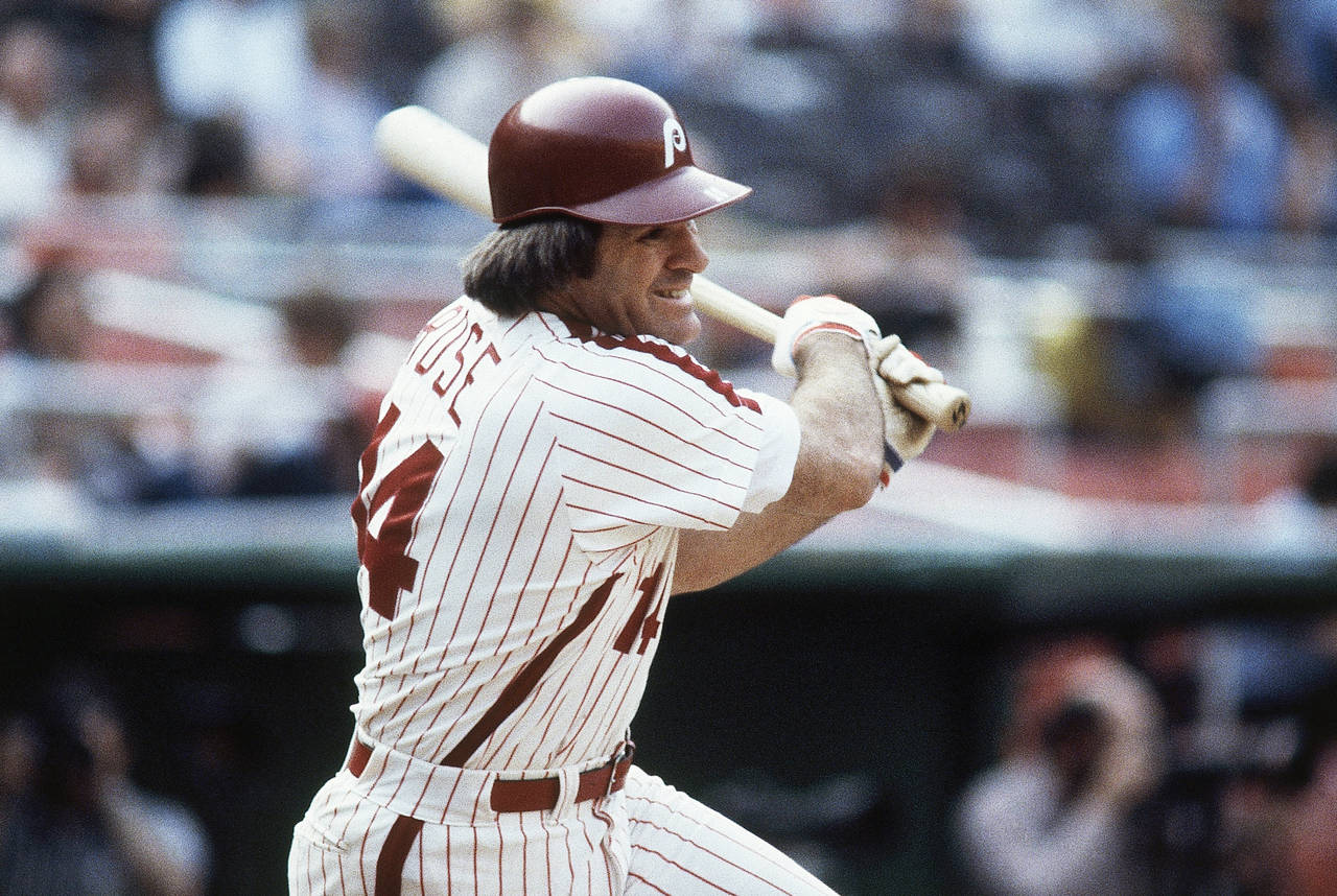 FILE - Philadelphia Phillies' Pete Rose bats during a 1980 baseball game. Rose will make an appeara...