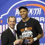 
              FILE - UNC Asheville's Dwayne Sutton, right, accepts the Big South Conference Tournament Most Valuable Player award from Commissioner Kyle B. Kallander after an NCAA collage basketball action in Buies Creek, N.C., March 6, 2016. Kallander has a unique perspective on the latest round of chaos in college athletics. As the final commissioner of the late, great Southwest Conference, he knows nothing is sacred. (AP Photo/Ben McKeown, File)
            