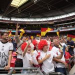 
              England, center, and Germany, left, supporters cheer on the stands before the Women's Euro 2022 final soccer match between England and Germany at Wembley stadium in London, Sunday, July 31, 2022. (AP Photo/Alessandra Tarantino)
            
