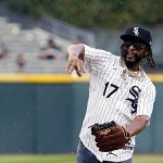 
              Lil Jon throws out a ceremonial first pitch before a baseball game between the Cleveland Guardians and the Chicago White Sox in Chicago, Friday, July 22, 2022. (AP Photo/Nam Y. Huh)
            