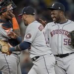 
              Houston Astros closing pitcher Hector Neris, right, greets catcher Martin Maldonado, left, and first baseman Yuli Gurriel after the team's 5-2 win in a baseball game against the Seattle Mariners, Friday, July 22, 2022, in Seattle. (AP Photo/Ted S. Warren)
            