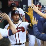 
              Atlanta Braves' William Contreras gets high-fives in the dugout hitting a two-run home run against the St. Louis Cardinals during the first inning of a baseball game Tuesday, July 5, 2022, in Atlanta. (Curtis Compton/Atlanta Journal-Constitution via AP)
            