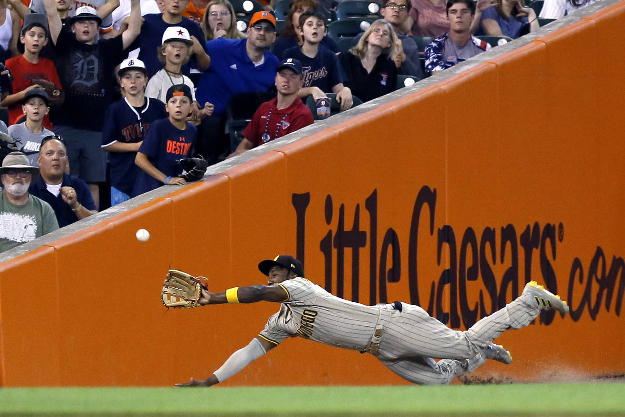 San Diego Padres left fielder Jurickson Profar makes a diving catch on a fly ball hit by Detroit Ti...