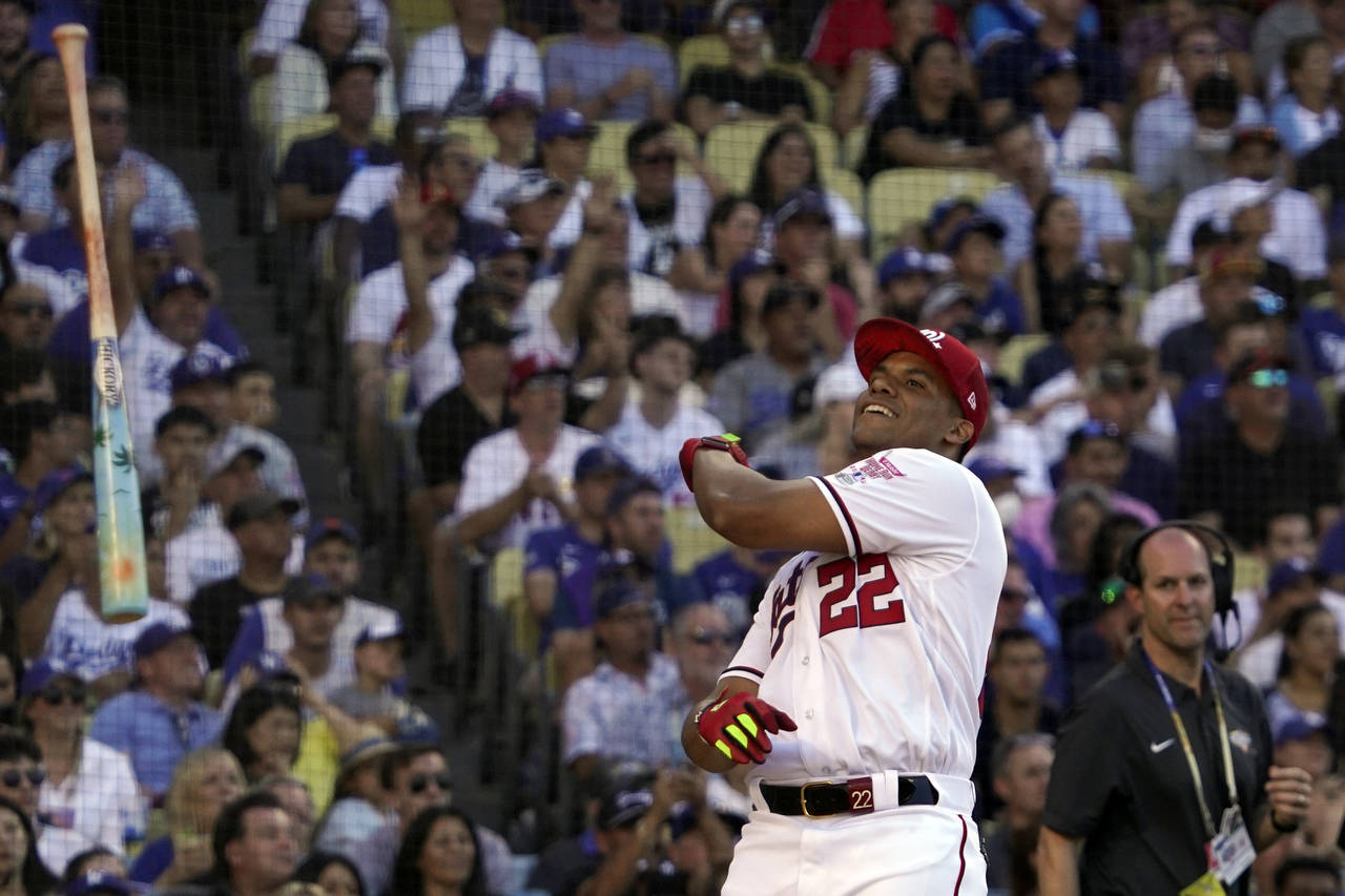 National League's Juan Soto, of the Washington Nationals, tosses his bat during the MLB All-Star ba...