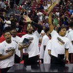 
              Portland Trail Blazers' Trendon Watford, center, celebrates with teammates after defeating the New York Knicks in an NBA summer league championship basketball game Sunday, July 17, 2022, in Las Vegas. (AP Photo/John Locher)
            