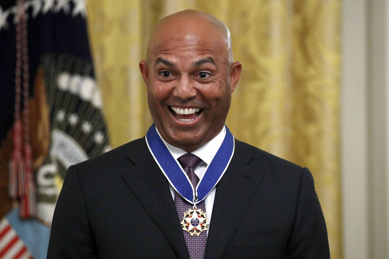 FILE - Former New York Yankees baseball pitcher Mariano Rivera smiles after being presented the Pre...