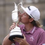 
              Cameron Smith, of Australia, kisses the claret jug trophy as he poses for photographers on the 18th green after winning the British Open golf Championship on the Old Course at St. Andrews, Scotland, Sunday July 17, 2022. (AP Photo/Peter Morrison)
            