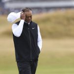 
              Tiger Woods of the US walks along the 3rd fairway during the second round of the British Open golf championship on the Old Course at St. Andrews, Scotland, Friday July 15, 2022. The Open Championship returns to the home of golf on July 14-17, 2022, to celebrate the 150th edition of the sport's oldest championship, which dates to 1860 and was first played at St. Andrews in 1873. (AP Photo/Peter Morrison)
            