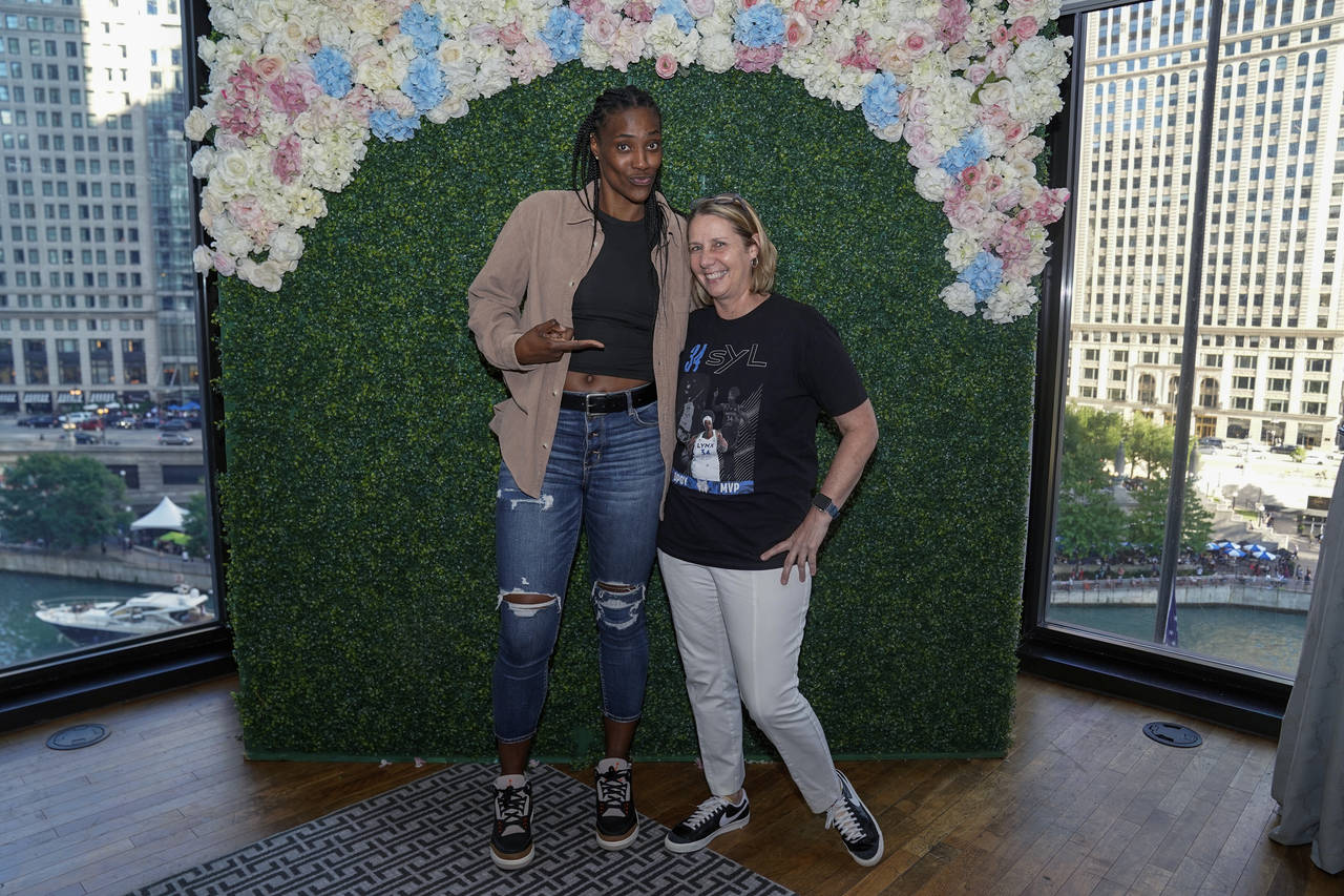 In a photo provided by the Minnesota Lynx, Minnesota Lynx's Sylvia Fowles, left, poses for a photo ...
