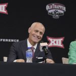 
              CORRECTS SPELLING OF LAST NAME TO YORMARK, NOT YORKMAN AS ORIGINALLY SENT - Incoming Big 12 Commissioner Brett Yormark smiles during a news conference opening the NCAA college football Big 12 media days in Arlington, Texas, Wednesday, July 13, 2022. At right is Baylor President Linda Livingstone. (AP Photo/LM Otero)
            