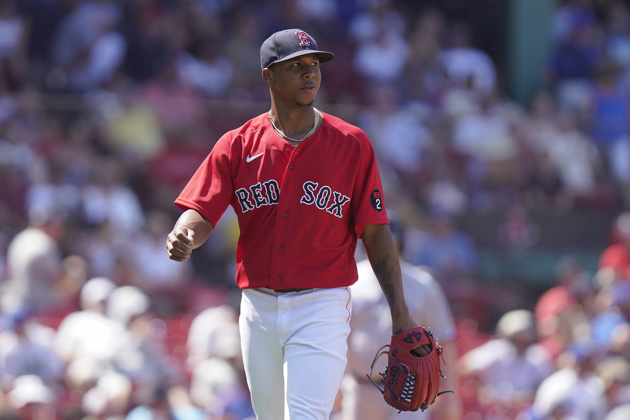 Boston Red Sox's Brayan Bello walks to the dugout after pitching in the third inning of a baseball ...