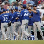 
              The Toronto Blue Jays celebrate after defeating the Boston Red Sox in a baseball game, Saturday, July 23, 2022, in Boston. (AP Photo/Michael Dwyer)
            