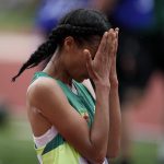 
              Letesenbet Gidey, of Ethiopia, reacts after winning the women's 10000-meter run final at the World Athletics Championships on Saturday, July 16, 2022, in Eugene, Ore. (AP Photo/Ashley Landis)
            