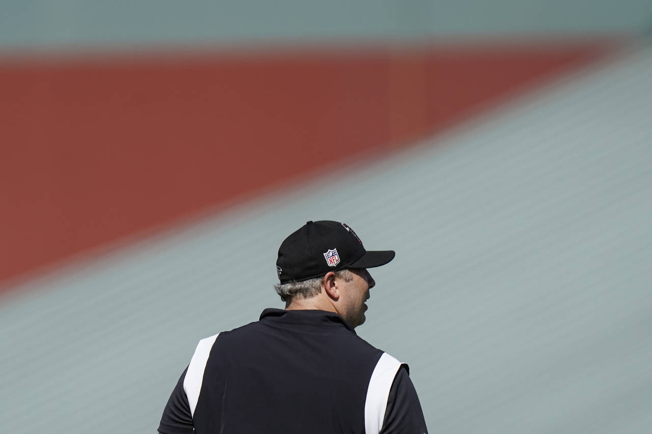 Atlanta Falcons head coach Arthur Smith takes part in drills at the NFL football team's practice fa...