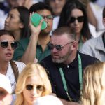 
              Former England soccer star Wayne Rooney and his wife Colleen watch Serbia's Novak Djokovic play Britain's Cameron Norrie in a men's singles semifinal on day twelve of the Wimbledon tennis championships in London, Friday, July 8, 2022. (AP Photo/Alastair Grant)
            