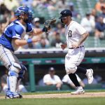
              Detroit Tigers' Tucker Barnhart scores as Kansas City Royals catcher Cam Gallagher (36) waits for the throw in the seventh inning of a baseball game in Detroit, Sunday, July 3, 2022. (AP Photo/Paul Sancya)
            
