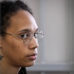 
              WNBA star and two-time Olympic gold medalist Brittney Griner sits in a cage at a court room prior to a hearing, in Khimki just outside Moscow, Russia, Wednesday, July 27, 2022. Griner testified Wednesday at her drug trial in Russia that a language interpreter provided during her questioning translated only a fraction of what was said and officials instructed her to sign documents without providing an explanation. (AP Photo/Alexander Zemlianichenko, Pool)
            