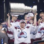 
              Colorado Avalanche right wing Valeri Nichushkin lifts the Stanley Cup during a rally outside the City/County Building for the NHL hockey champions after a parade through the streets of downtown Denver, Thursday, June 30, 2022. (AP Photo/David Zalubowski)
            