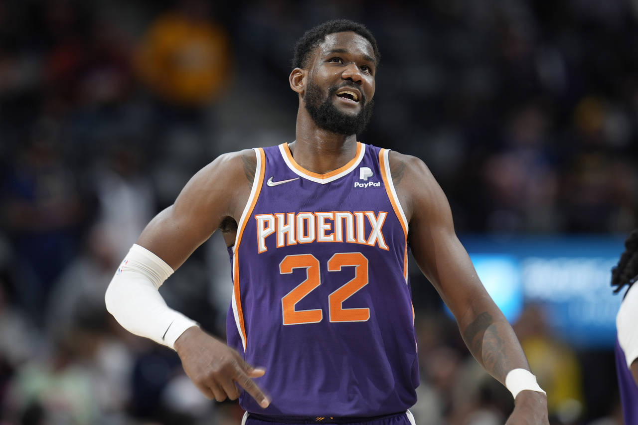 FILE - Phoenix Suns center Deandre Ayton looks on during the second half of an NBA basketball game ...