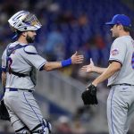
              New York Mets relief pitcher Seth Lugo (67) and catcher Tomas Nido (3) congratulate each other after the Mets beat the Miami Marlins 4-0 during a baseball game, Saturday, July 30, 2022, in Miami. (AP Photo/Wilfredo Lee)
            